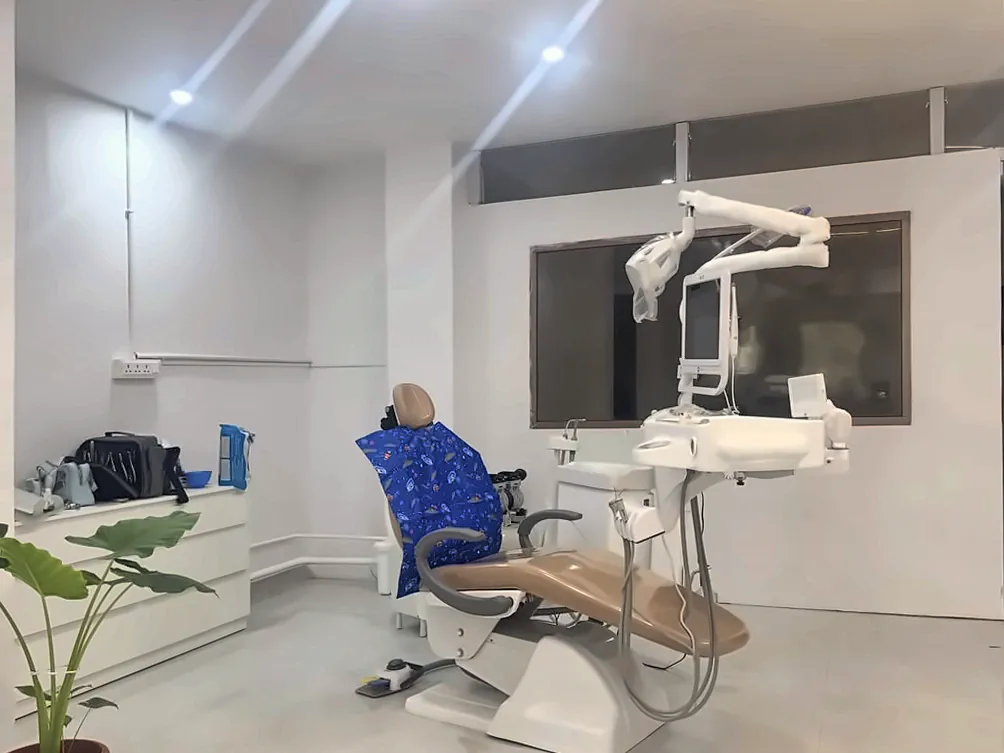 Dental chair and treatment unit in the treatment room at Supriya Multispeciality Dental Clinic